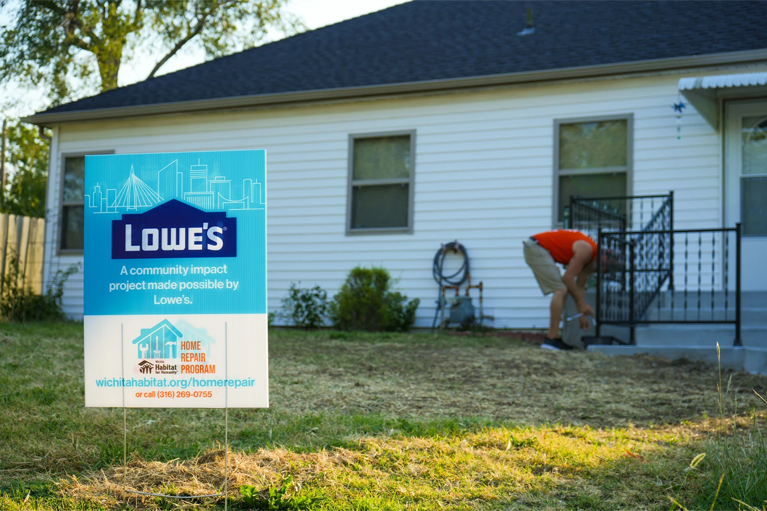 A Lowe's yard sign staked in front of a home.